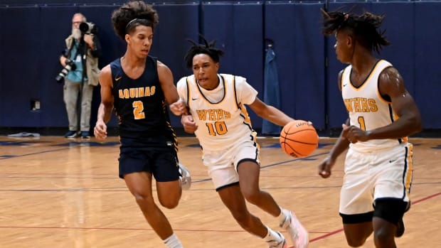 Winter Haven guard Eric Dailey drives the ball up floor against St. Thomas Aquinas on Saturday at the Kingdom in the Sun Tournament at Vanguard High School in Ocala. 